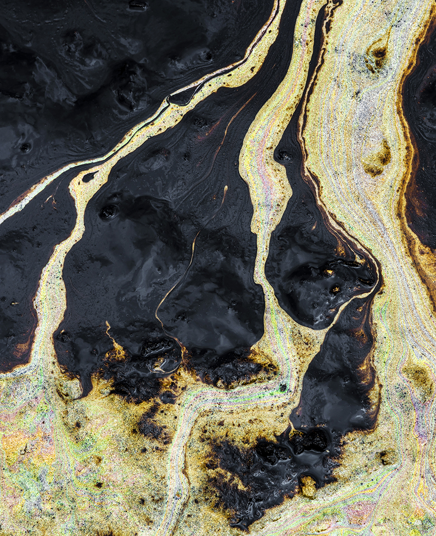 Texture of Crude oil spill on sand beach from oil spill accident